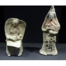 Demeter, seated female terracotta nursing a child